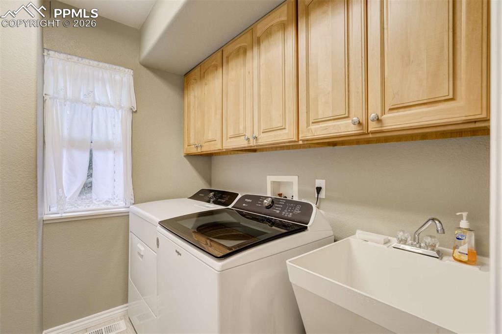 4618 Bethany Court Colorado Springs, CO 80918 - Photo 16 of 50 a kitchen with a sink and cabinets