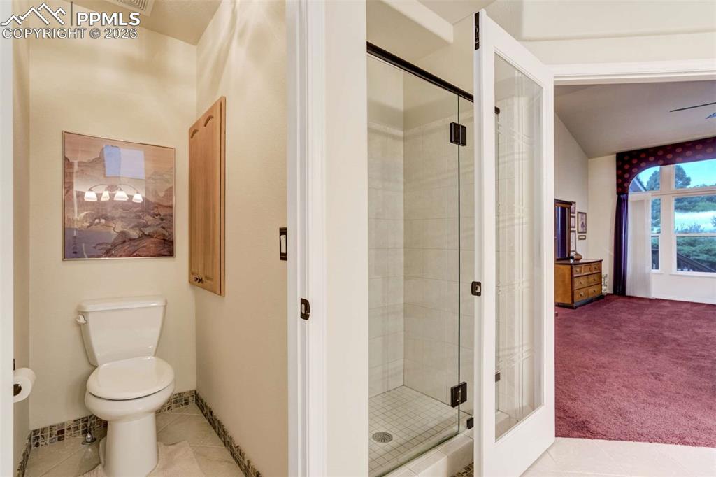 4618 Bethany Court Colorado Springs, CO 80918 - Photo 21 of 50 a bathroom with a toilet a sink and shower