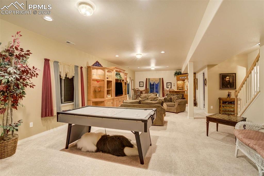 4618 Bethany Court Colorado Springs, CO 80918 - Photo 33 of 50 a living room with furniture a large window and potted plants
