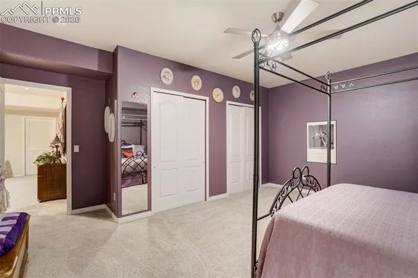 a bed room with a bed and a chandelier