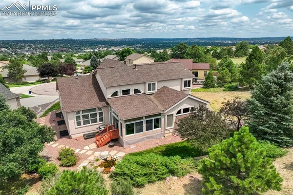 an aerial view of house with yard