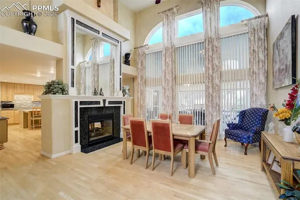 a dining room with furniture and window