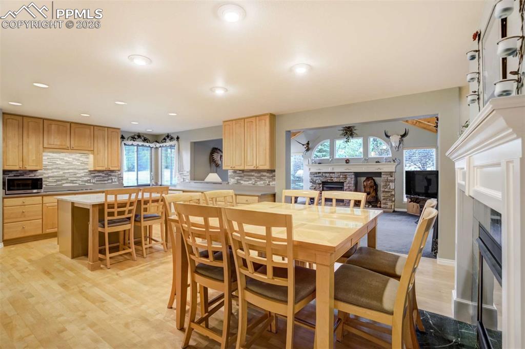 4618 Bethany Court Colorado Springs, CO 80918 - Photo 8 of 50 a large kitchen with a table and chairs