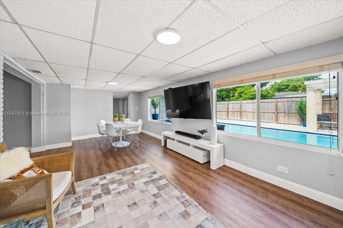 3751 Northeast 16th Avenue Pompano Beach, FL 33064 - Photo 11 of 41 a living room with furniture and a flat screen tv