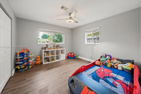 a play room with toys and a tv