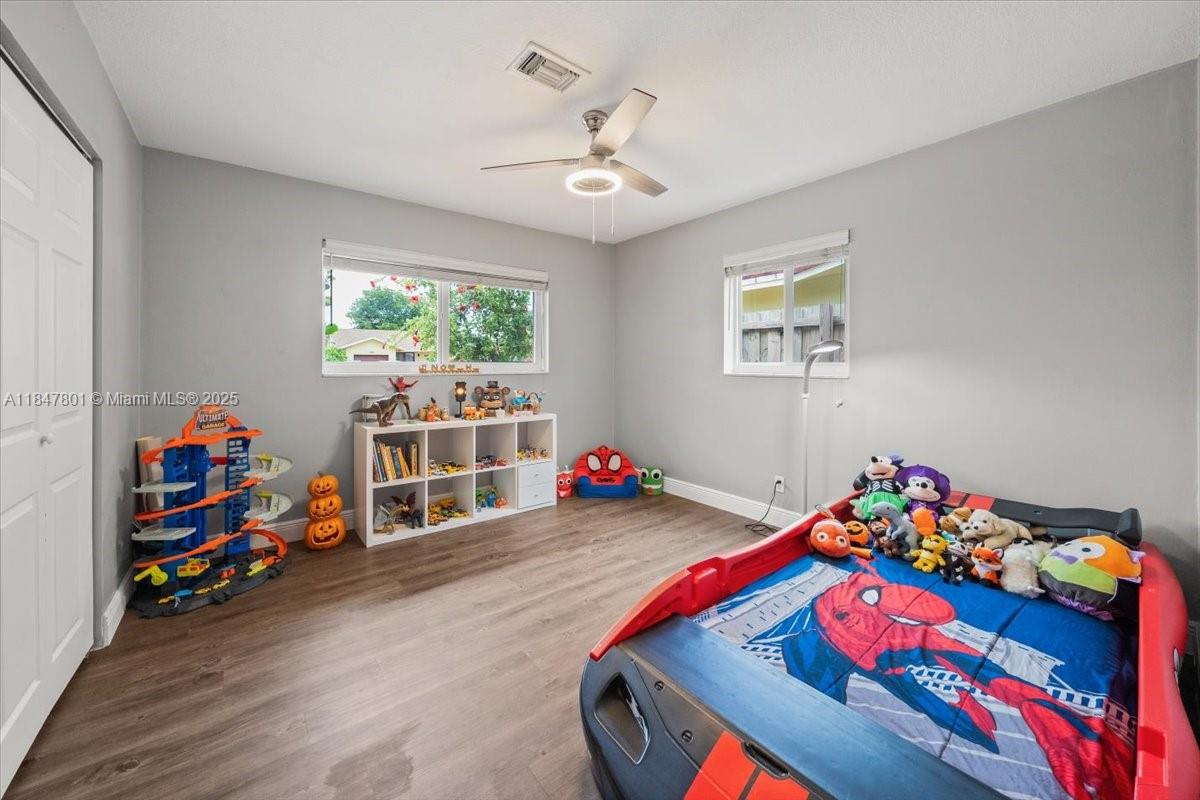 3751 Northeast 16th Avenue Pompano Beach, FL 33064 - Photo 21 of 41 a play room with toys and a tv