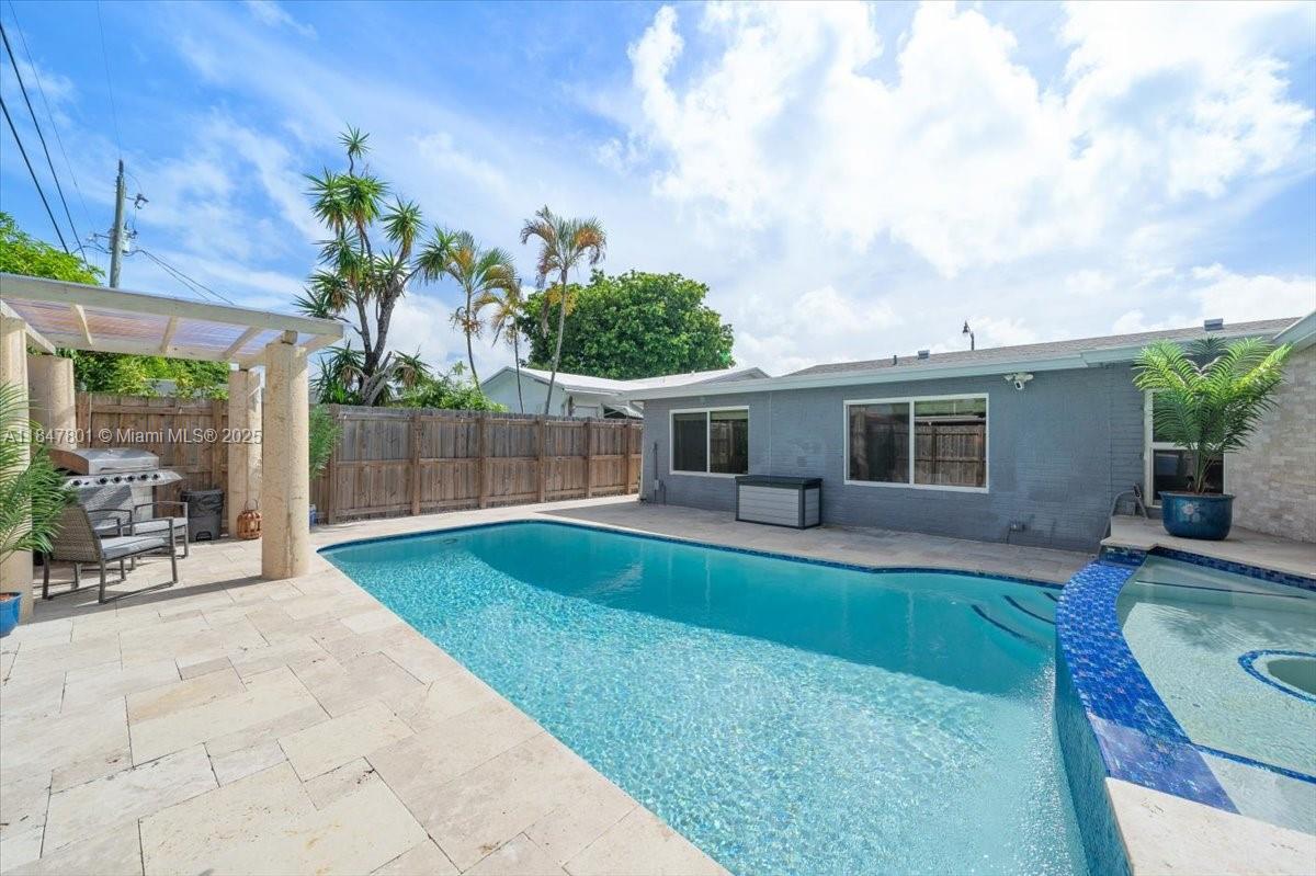 3751 Northeast 16th Avenue Pompano Beach, FL 33064 - Photo 26 of 41 a view of a backyard with a sitting area