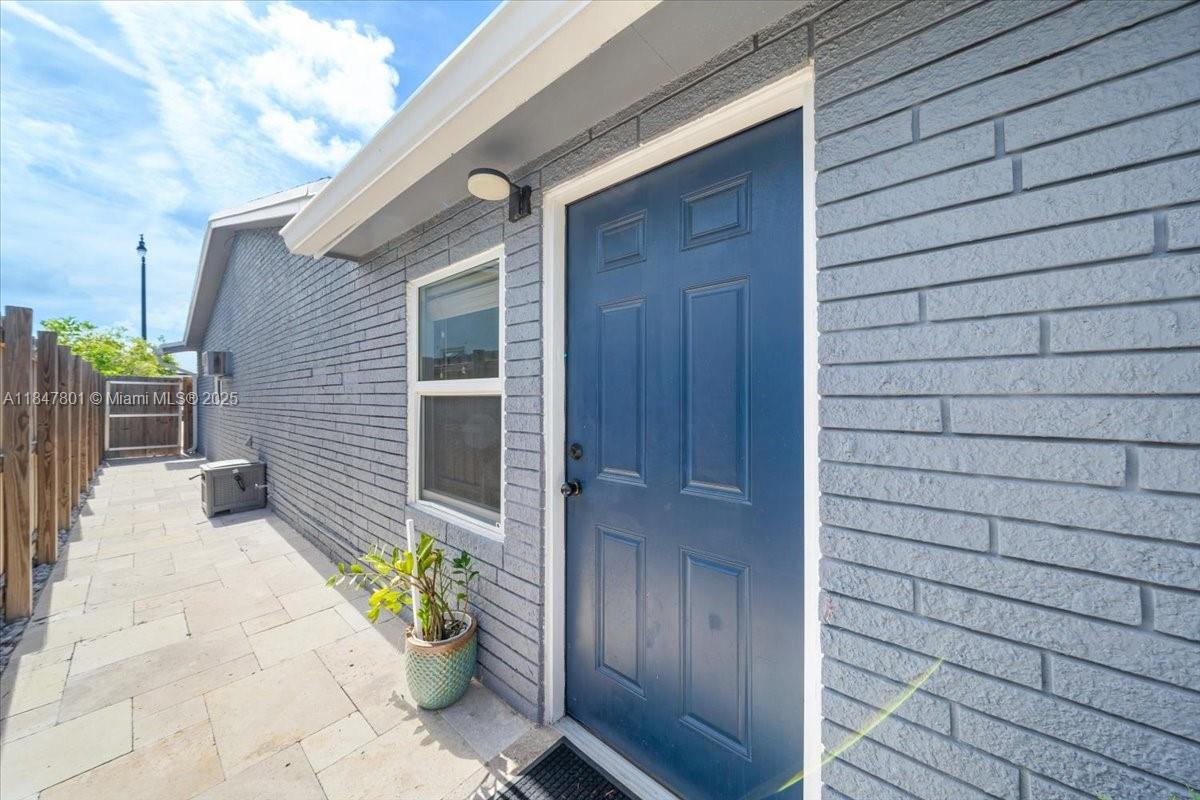 3751 Northeast 16th Avenue Pompano Beach, FL 33064 - Photo 28 of 41 a front view of a house with a patio