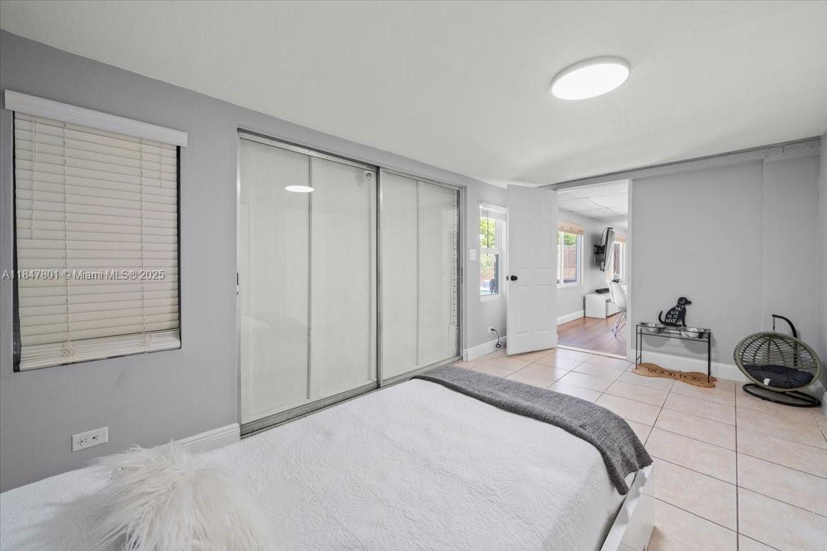 3751 Northeast 16th Avenue Pompano Beach, FL 33064 - Photo 36 of 41 a bedroom with bed and a closet