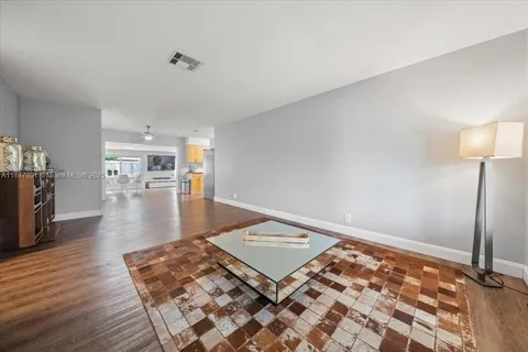 a living room with a rug