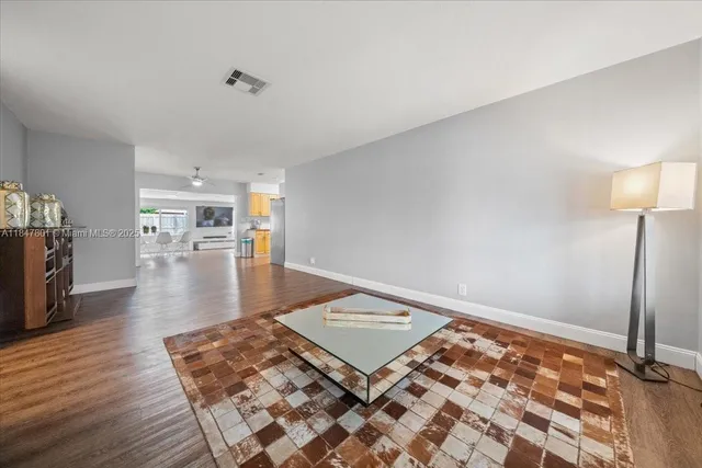 a living room with a rug