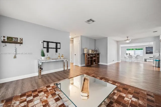 a living room with furniture and a table