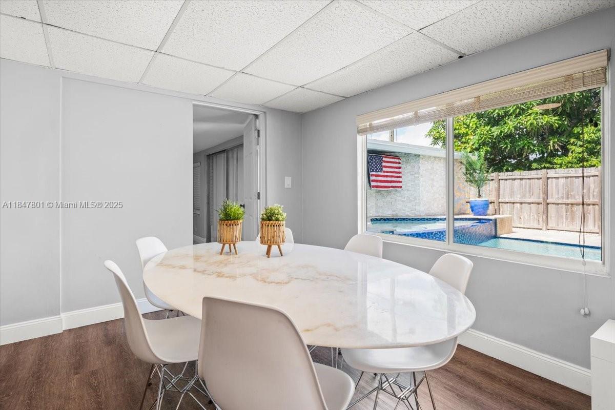 3751 Northeast 16th Avenue Pompano Beach, FL 33064 - Photo 10 of 41 a view of a dining room with furniture window and wooden floor