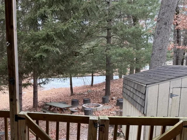 a view of a wooden deck next to a yard