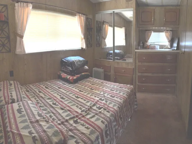 a bedroom with a bed and window