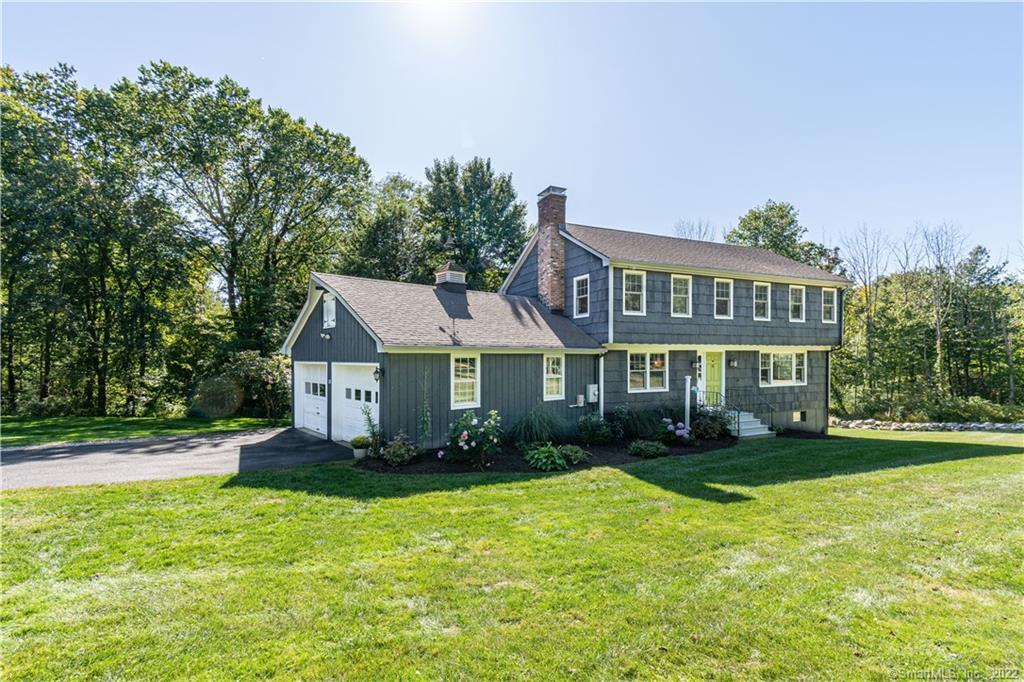 33 Pheasant Ridge Road Redding, CT 06896 - Photo 1 of 1 a front view of a house with a yard