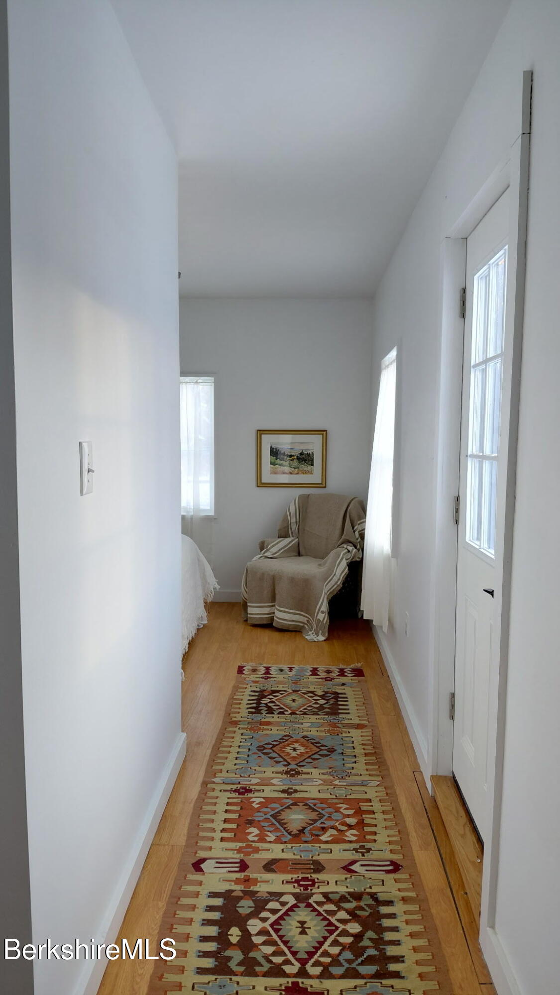 95 Water Farm Road Sheffield, MA 01257 - Photo 15 of 27 a bed room with a bed and glass door