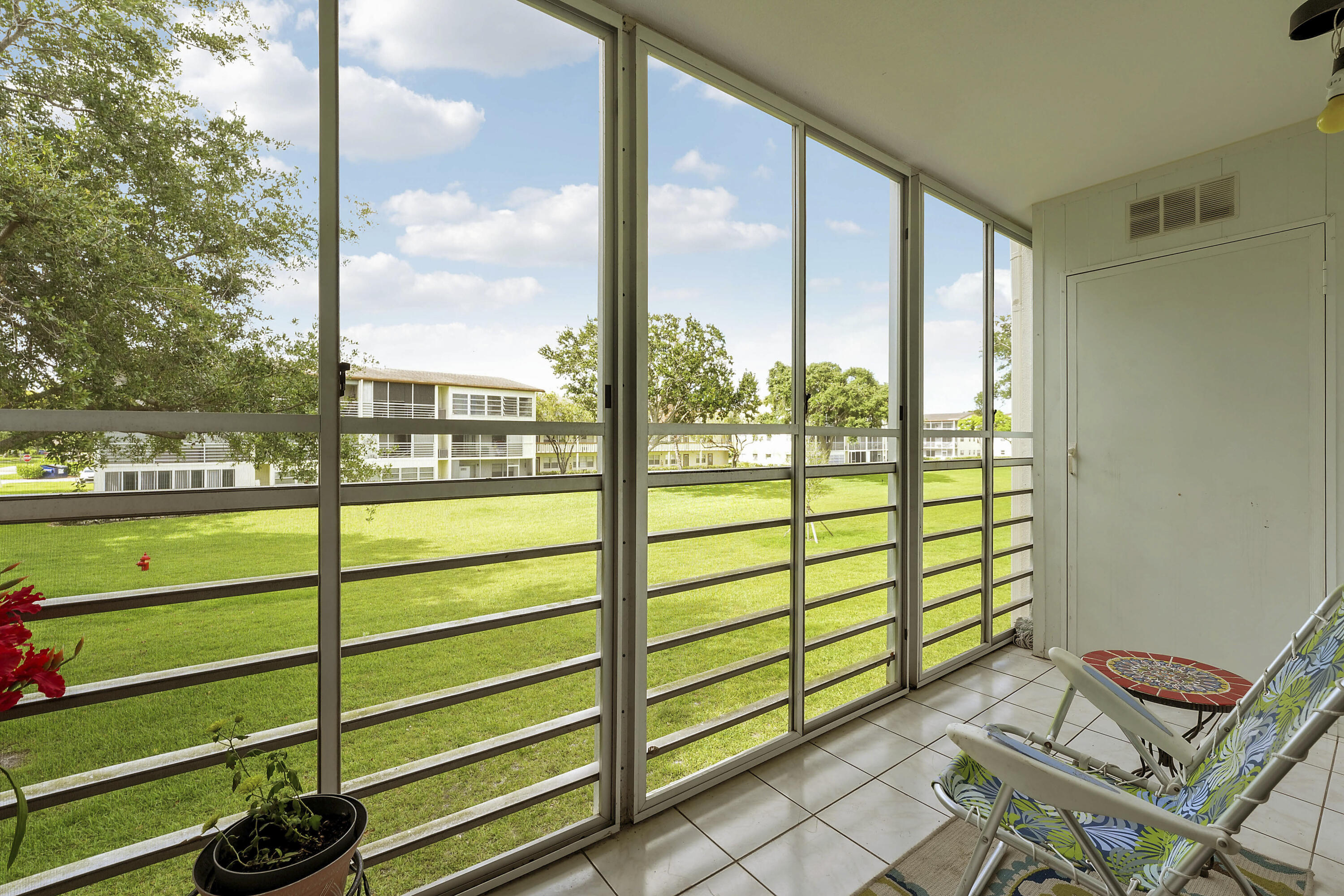 16 Mansfield B Boca Raton, FL 33434 - Photo 13 of 15 a view of a porch with a bench