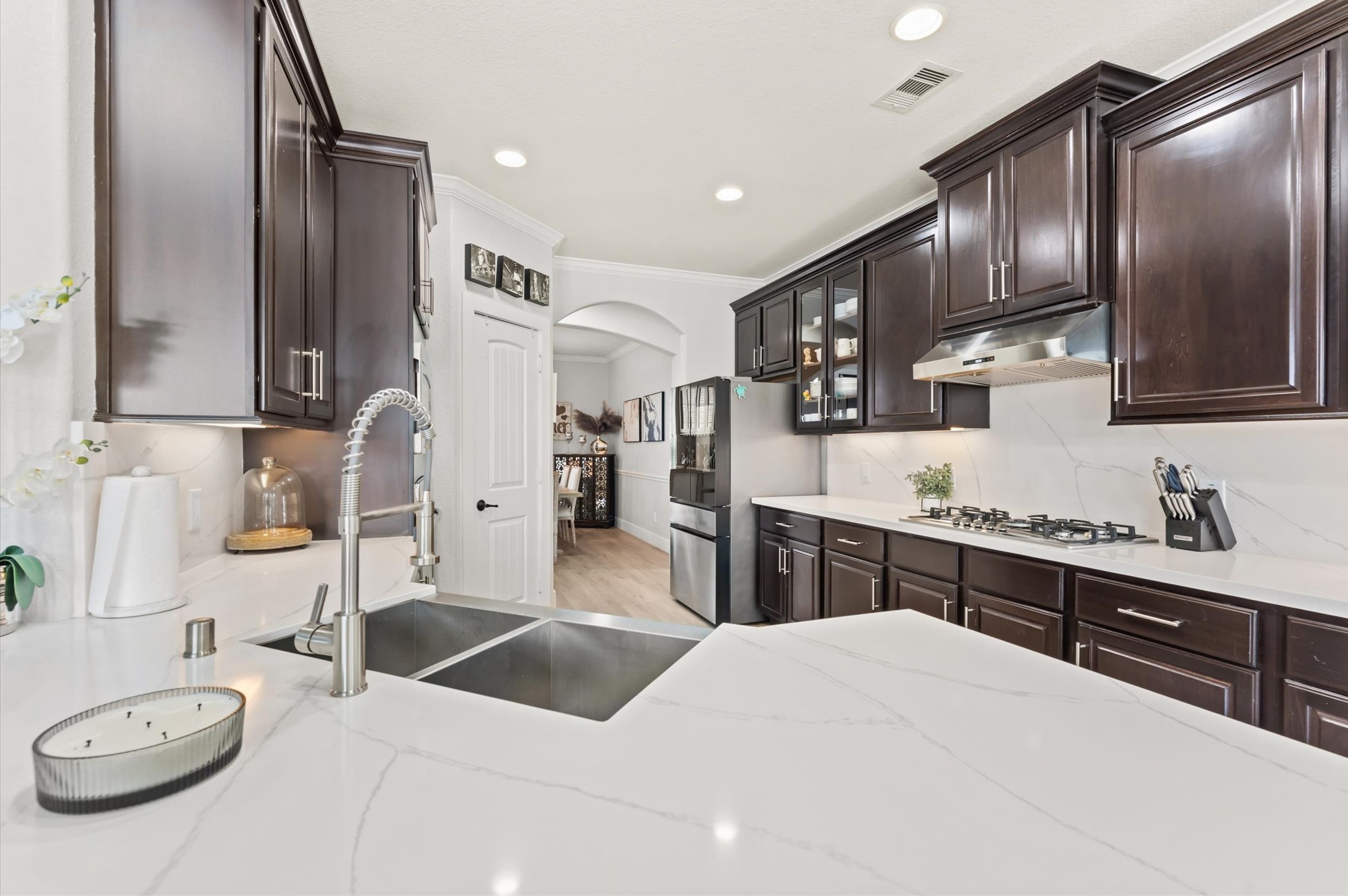 14016 Savannah Landing Lane Rosharon, TX 77583 - Photo 19 of 49 a large kitchen with stainless steel appliances granite countertop a sink refrigerator and cabinets