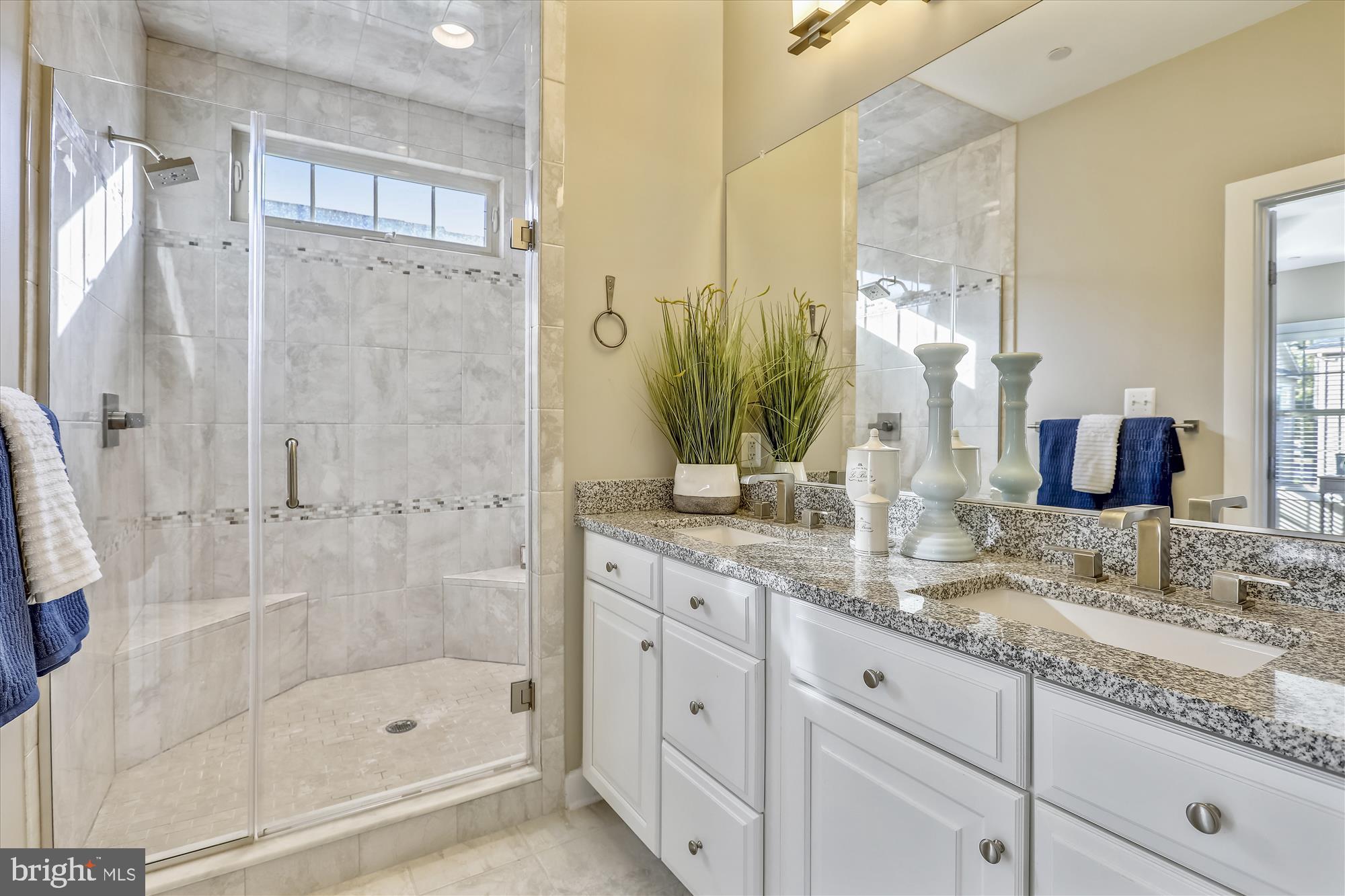 1024 Mutual Place Sandy Spring, MD 20860 - Photo 20 of 28 a bathroom with a granite countertop sink two mirror and shower
