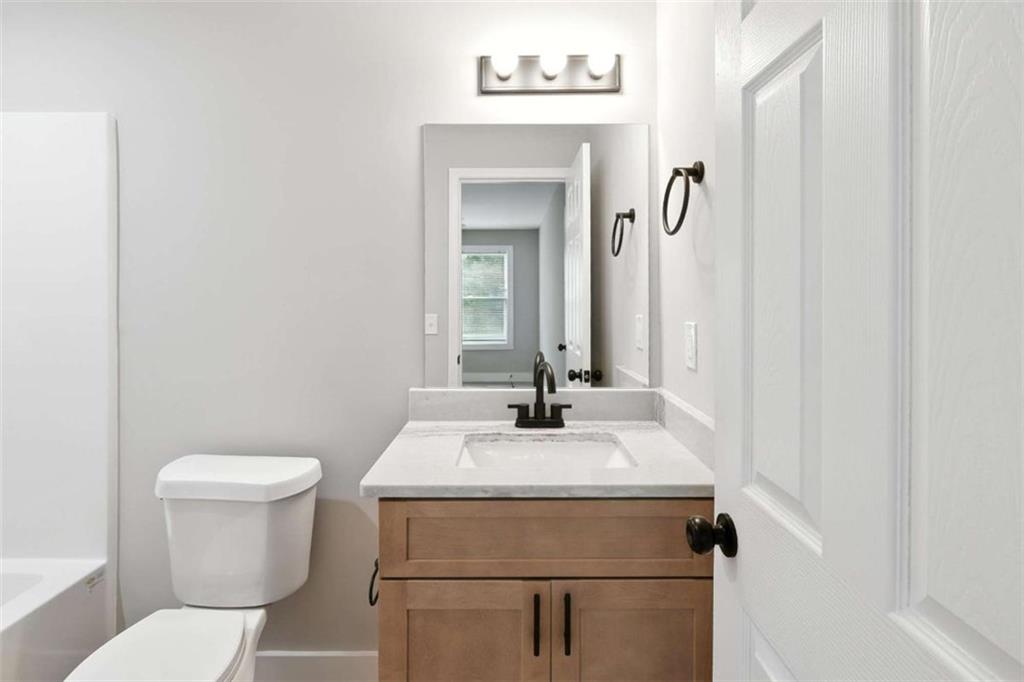 159 Brad Street Royston, GA 30662 - Photo 19 of 21 a bathroom with a sink toilet and mirror