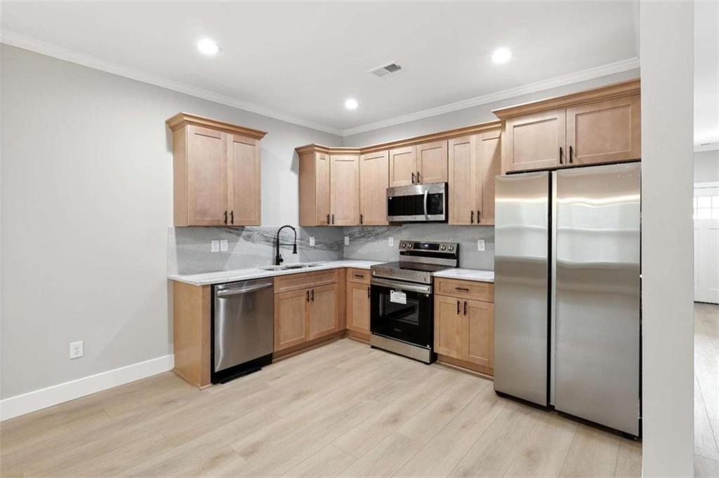 159 Brad Street Royston, GA 30662 - Photo 5 of 21 a kitchen with a refrigerator sink and microwave