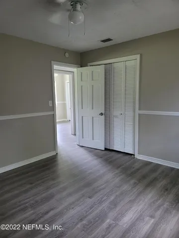 a view of a livingroom with wooden floor