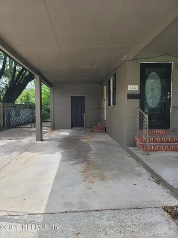 a view of a room with a bed