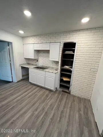 a kitchen with a sink and cabinets