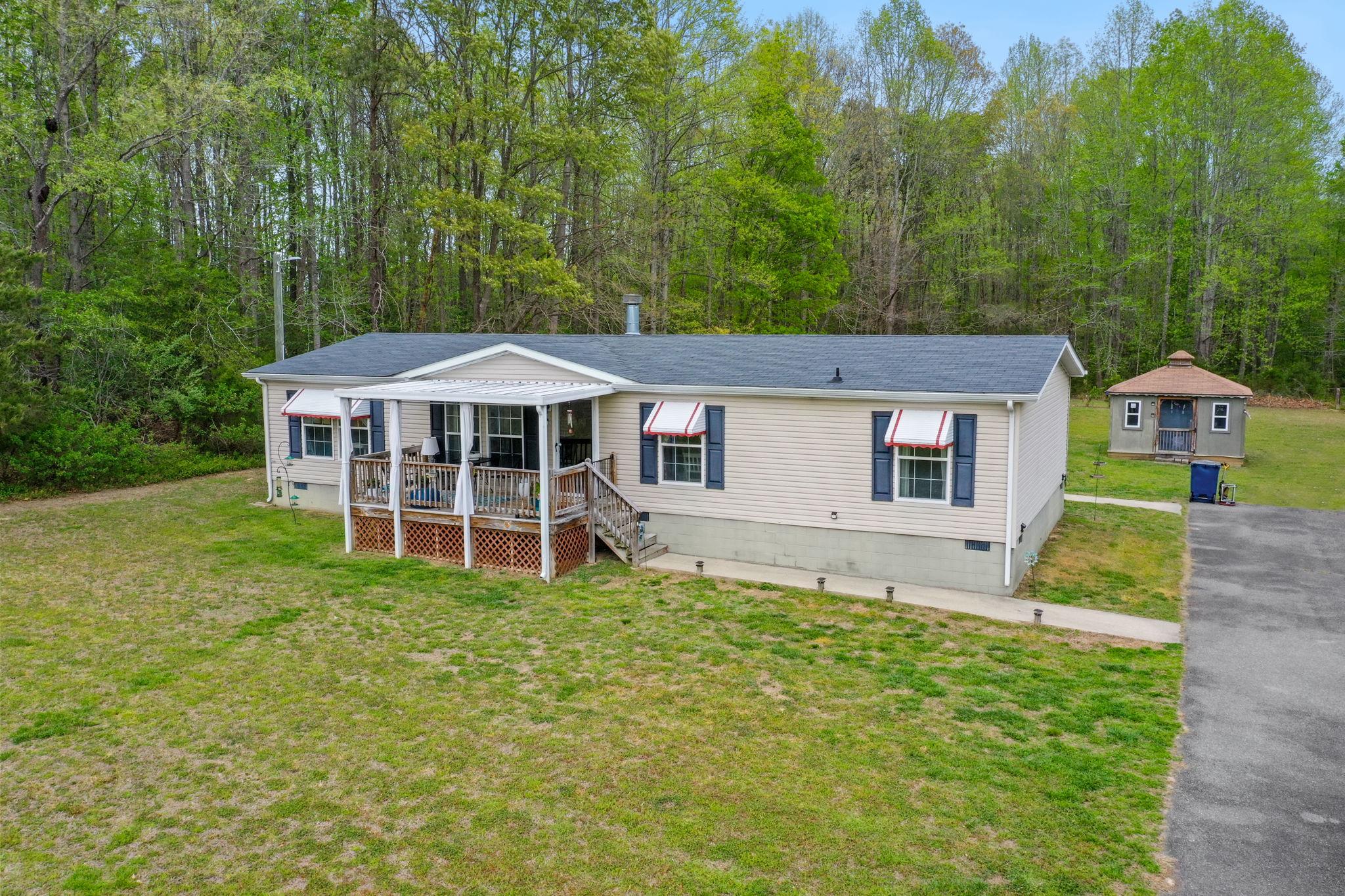 986 Lewis Level Road Tappahannock, VA 22560 - Photo 1 of 24 Charming home nestled in nature's embrace.