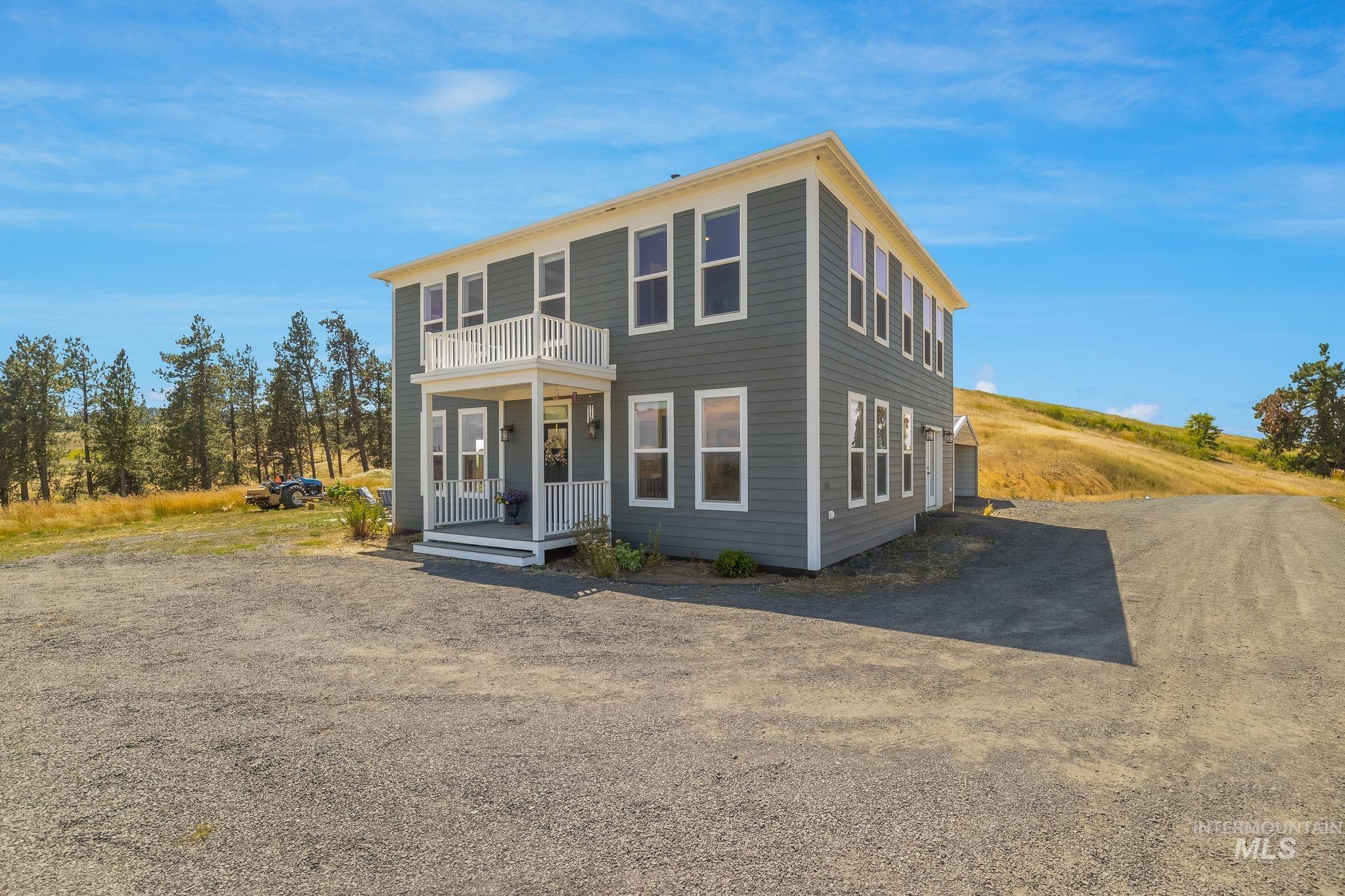 4935 Lenville Road Moscow, ID 83843 - Photo 6 of 49 Two-story residence featuring grey horizontal siding and white trim