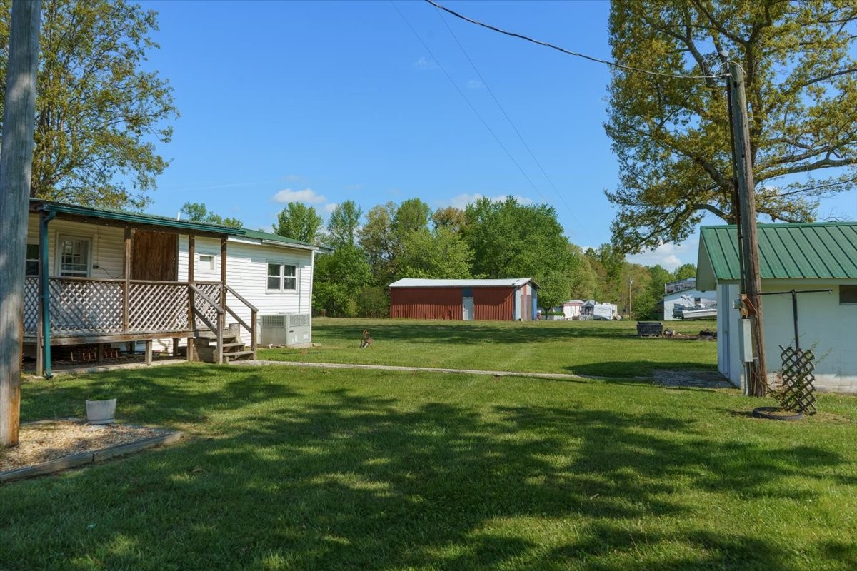 108 Floyd Road Manchester, TN 37355 - Photo 26 of 37 a front view of a house with a yard and trees
