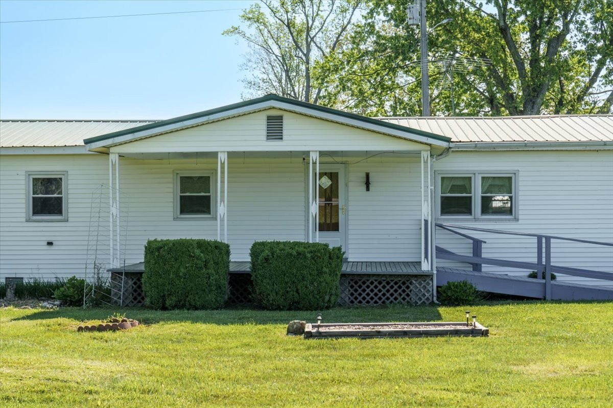 108 Floyd Road Manchester, TN 37355 - Photo 3 of 37 a front view of a house with a yard