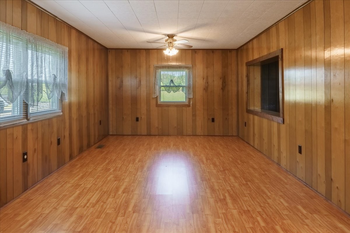 108 Floyd Road Manchester, TN 37355 - Photo 5 of 37 an empty room with wooden floor and windows