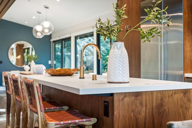 a kitchen with stainless steel appliances granite countertop a stove and refrigerator