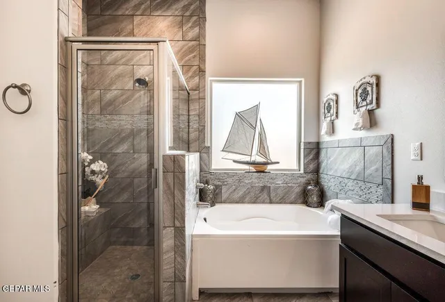 a bathroom with a bathtub and a sink