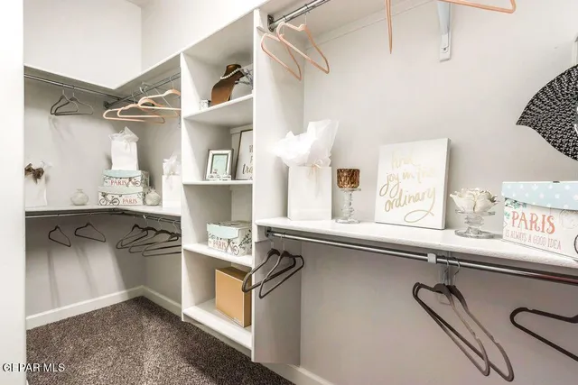 a kitchen with a sink a stove and cabinets