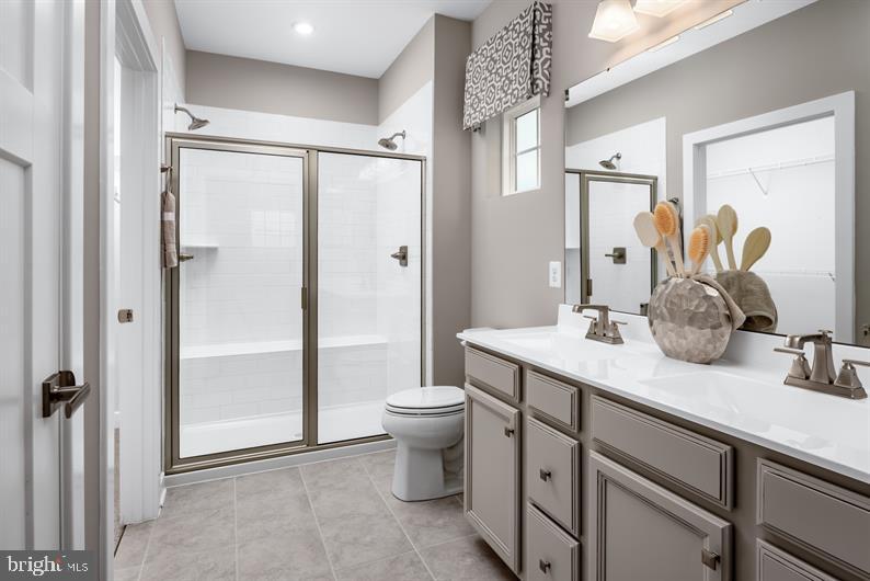 319 Ruffian Road Camp Hill, PA 17011 - Photo 9 of 18 a bathroom with a double vanity sink toilet and shower