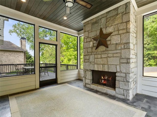 a kitchen with stainless steel appliances kitchen island granite countertop a sink and cabinets