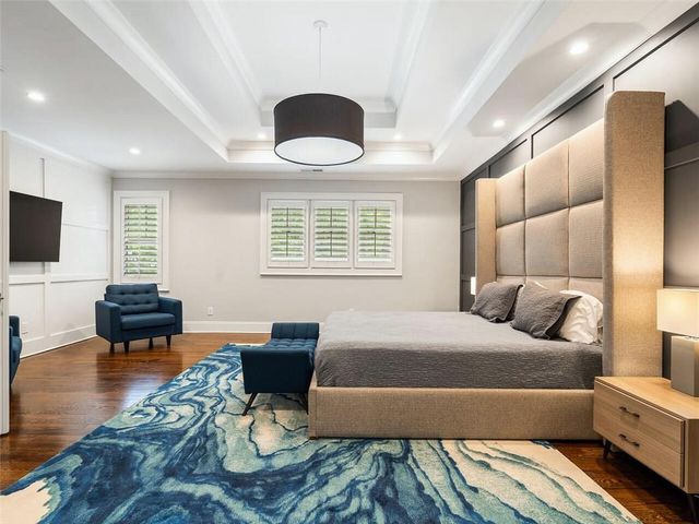 a spacious bathroom with a granite countertop sink a toilet and a shower