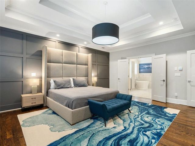 a bathroom with a granite countertop sink a toilet and a bathtub