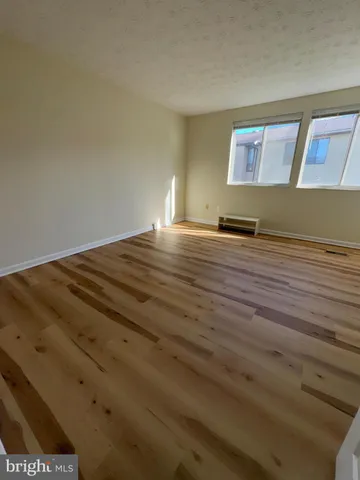 a view of room and wooden floor