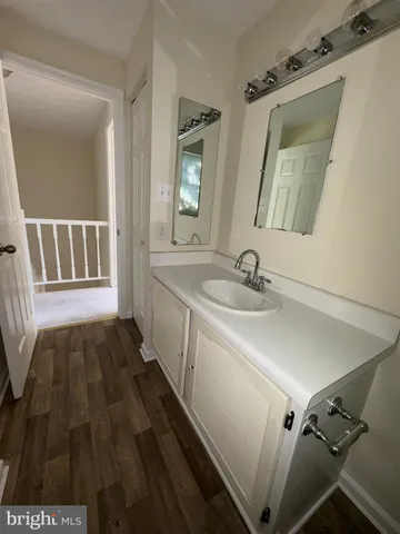 a bathroom with a sink and mirror