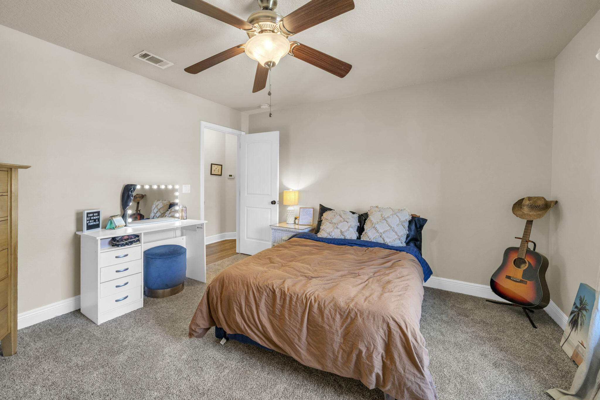 217 Raptor Drive Crestview, FL 32536 - Photo 40 of 48 a bedroom with a bed and a chandelier