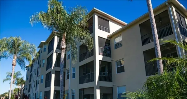 a view of a house with a tree