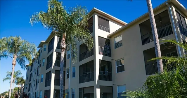 a view of a house with a tree