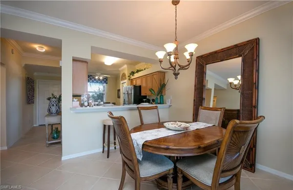 a dining room with a table and chairs