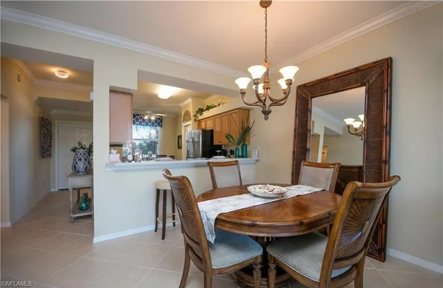 a dining room with a table and chairs