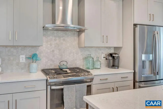 a kitchen with a refrigerator and a sink