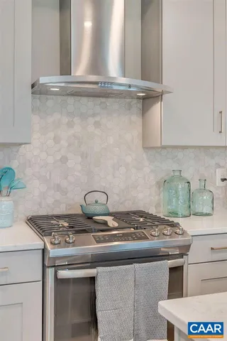 a kitchen with a sink a counter space and stainless steel appliances